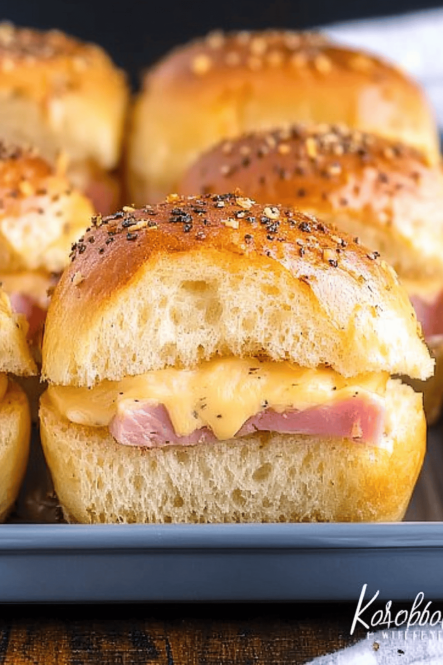 ham cheese sliders slice on plate showing perfect texture and swirl pattern
