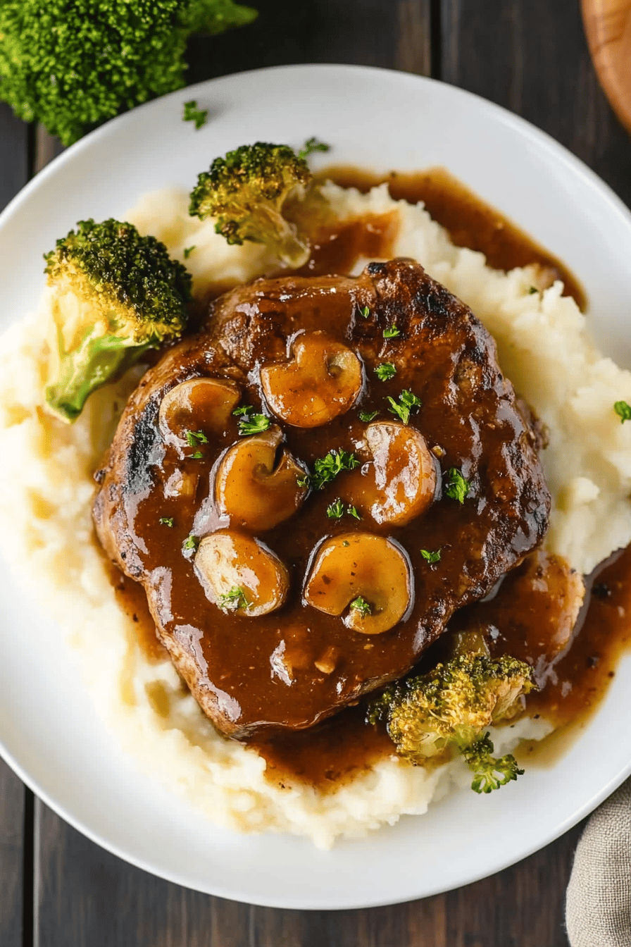 oven swiss steak slice on plate showing perfect texture and swirl pattern