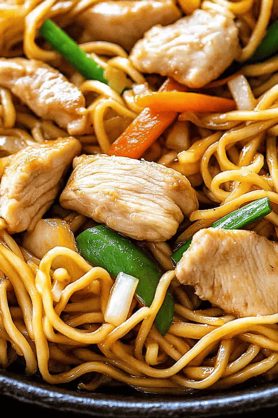 chicken chow mein ingredients organized and measured on kitchen counter
